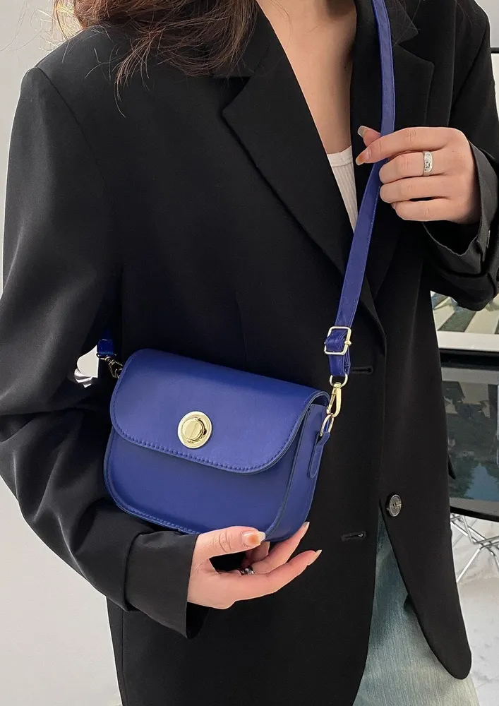 A LITTLE STATEMENT BLUE SLING BAG