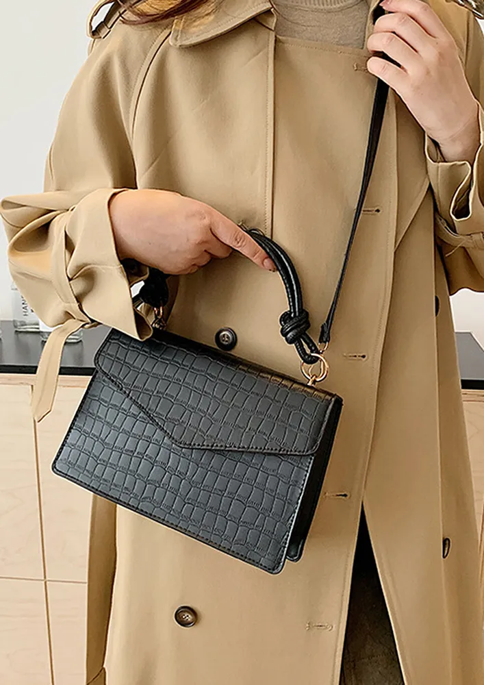 TEXTURED BLACK CONCEALED SNAP LOCK SLING BAG