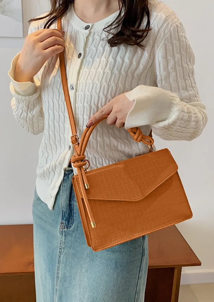 TEXTURED LIGHT BROWN CONCEALED SNAP LOCK SLING BAG