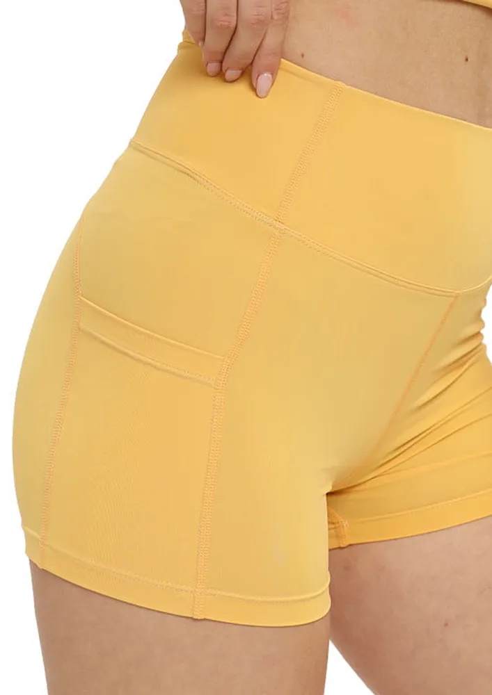 YELLOW POCKET-DETAIL YOGA SHORTS