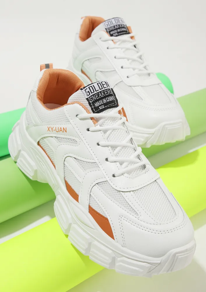 STATEMENT MAKING ORANGE TRAINERS