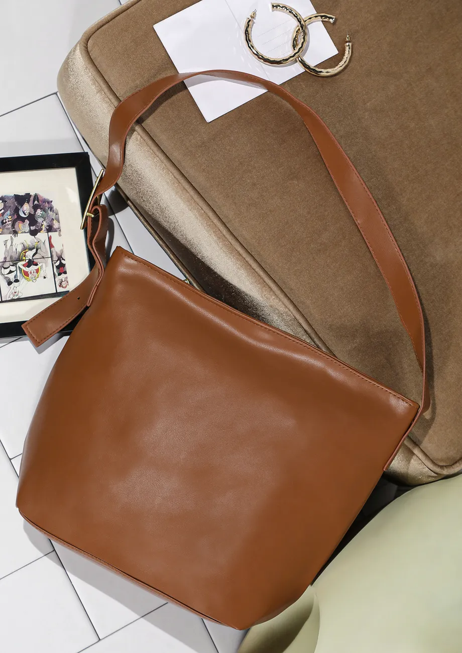 WORK MODE ON TAN BUCKET BAG