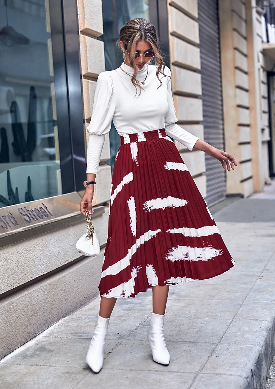 Buy THE SLIT RED ABTRACT PRINT PLEATED MIDI SKIRT for Women Online in India